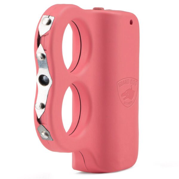 A pink self-defense tool with a knuckle duster design and eye holes.