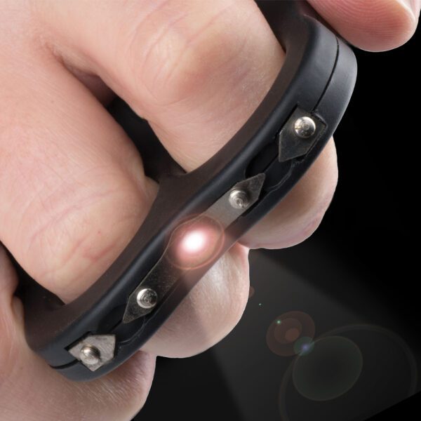 Hand wearing a black studded leather ring with a glowing light.