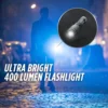Ultra bright 400 lumen flashlight shining in dark.